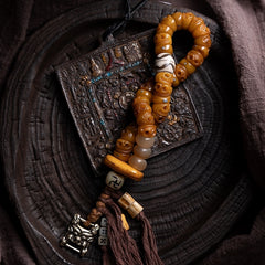 Tibetan Yak Bone Skull Bead Bracelet – Charnel Guardian, Tassel Design & Sacred Amulet Accents
