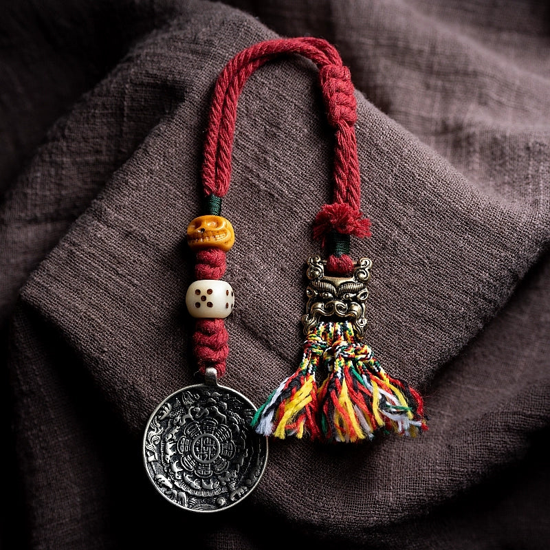 Tibetan Handwoven Amulet Tassel – Nine-Palace Charm, Bone Dice & Charnel Guardian Pendant for Bag, Car, or Waist