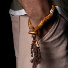 Tibetan Yak Bone Skull Bead Bracelet – Charnel Guardian, Tassel Design & Sacred Amulet Accents